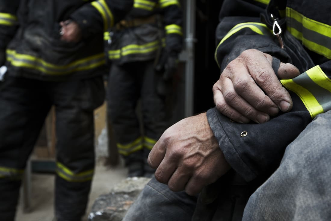 Hands of firefighter resting during the rescue work