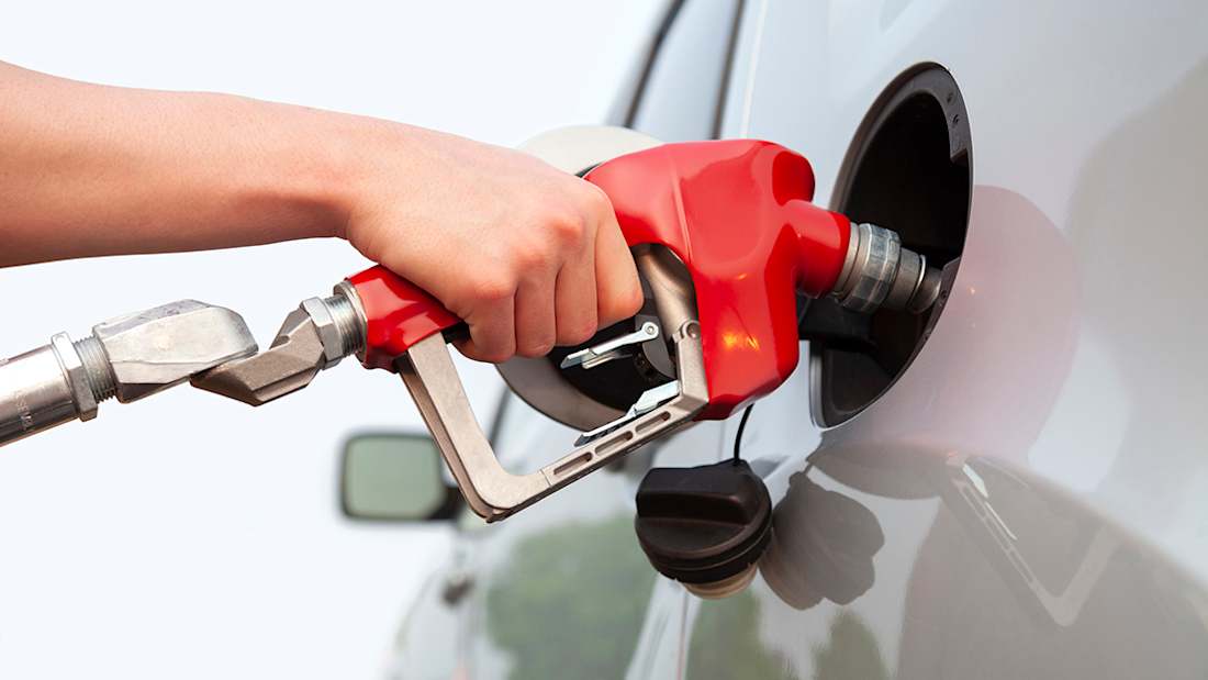 fueling a car at a gas pump