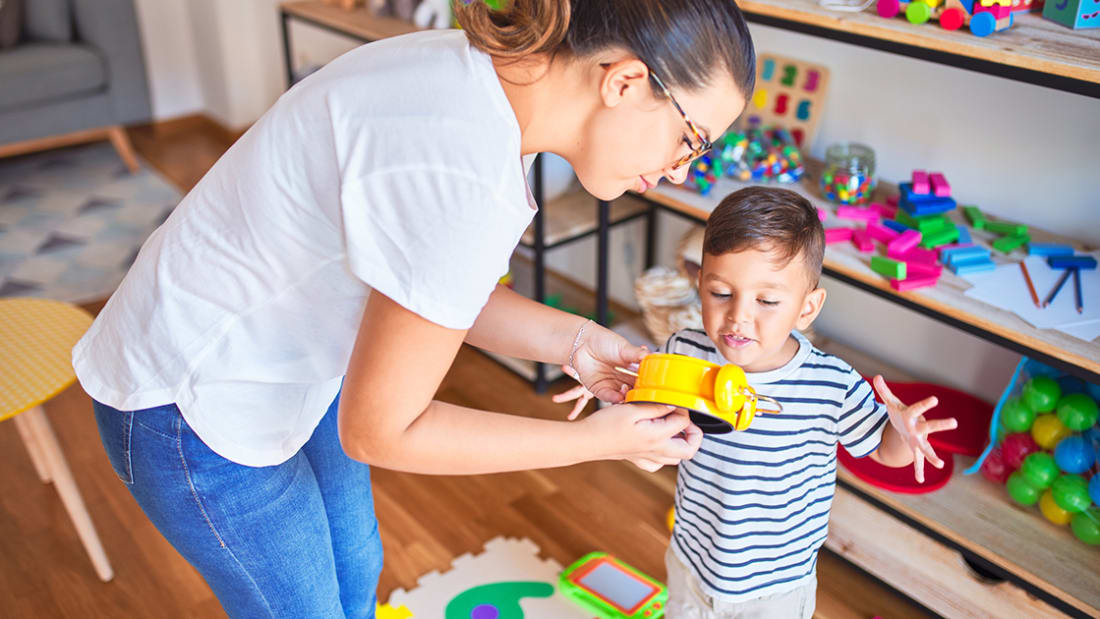 child at care center with lady