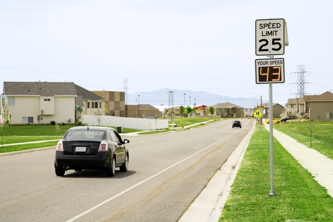 Photo of a motorist speeding in a residential school zone.