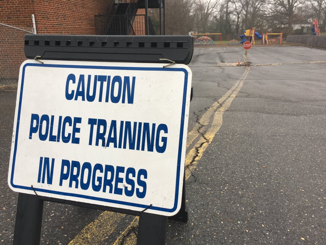 Sign that reads "caution police training in progress."