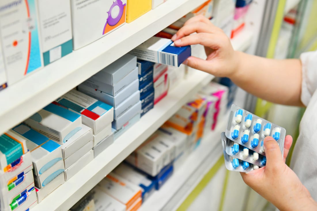 stocking prescription drugs at pharmacy