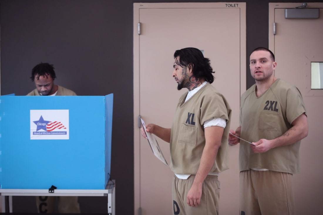 Inmates in line to vote at a voting booth in jail