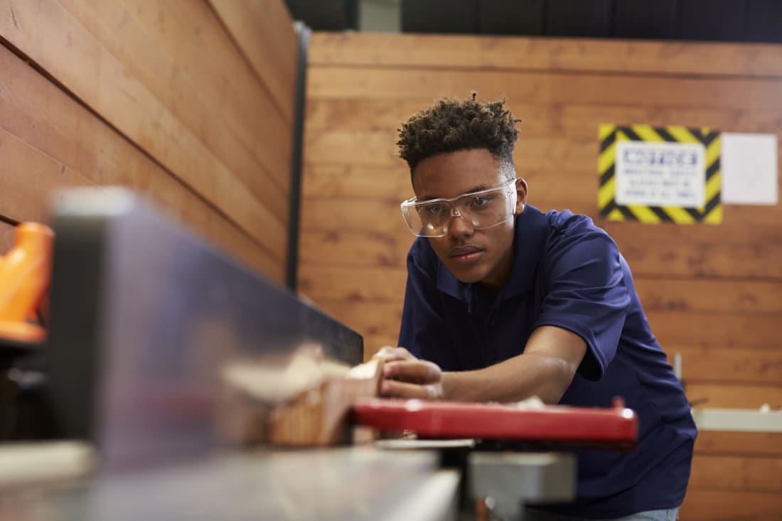 youth working in a wood shop