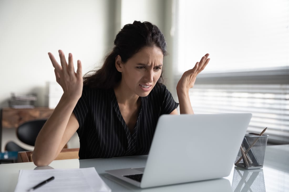 frustrated woman looking at computer