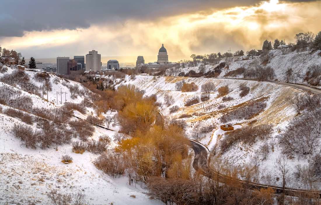 snowy hills with Salt Lake City in the background