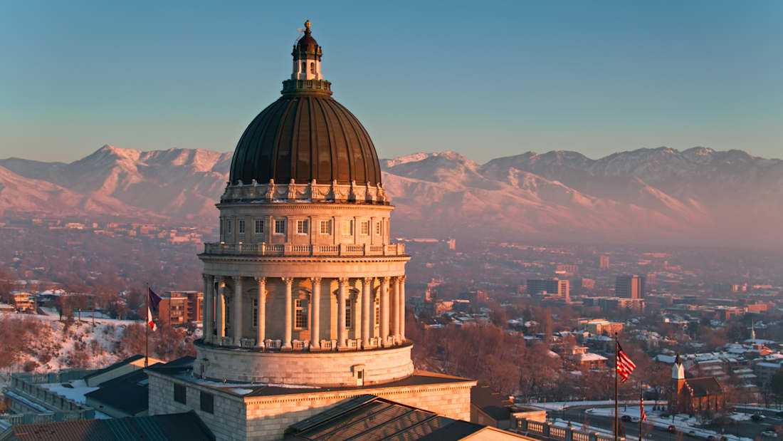Salt Lake City with Capitol building in foreground and mountains in background