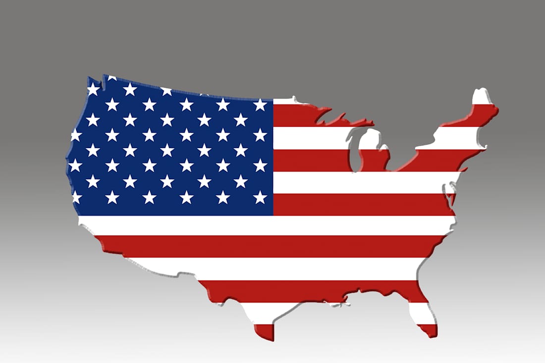 map of U.S covered with flag