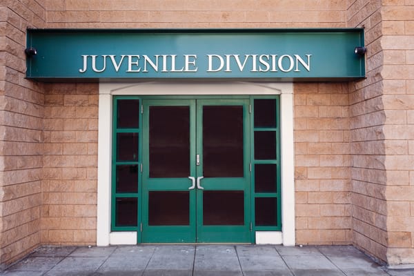 Building with the entrance reading "Juvenile Division" 