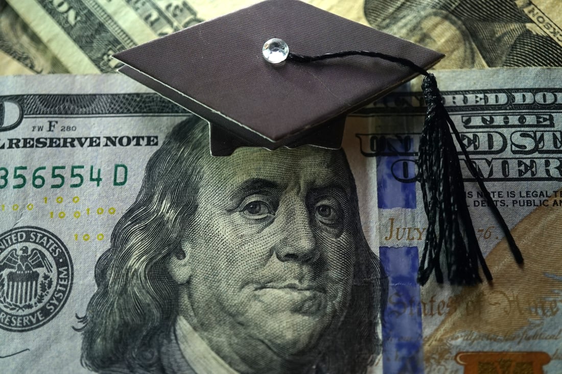 Ben Franklin on $100 bill wearing graduation cap