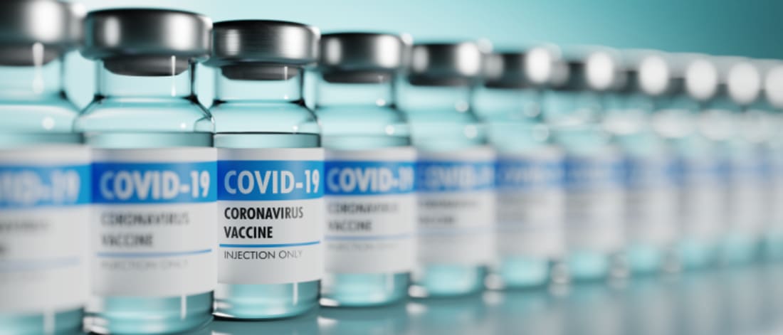 Row of Coronavirus vaccine flasks