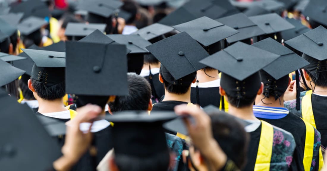 Crowd of graduates in caps and gowns