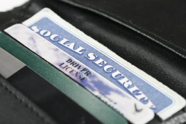 social security card and driver license in a wallet.