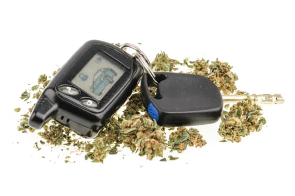 marijuana and car key isolated on white