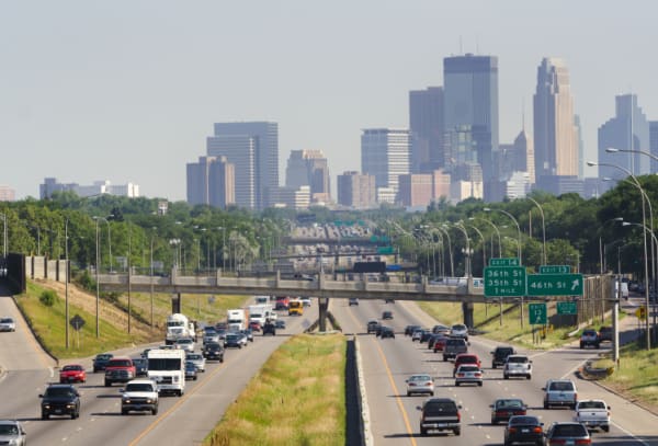 Busy multiple lane highway freeway leading into Minneapolis, Minnesota