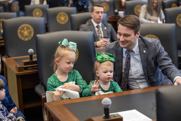 Oklahoma House Speaker Kyle Hilbert in the House chamber with his two daughters